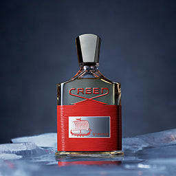 creed perfume red bottle