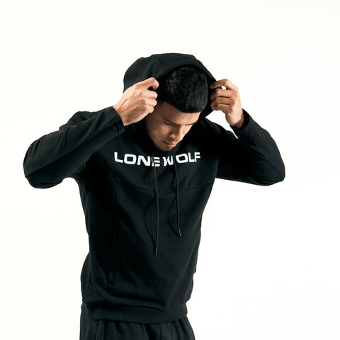 Man pulling his black hood up on the best gym hoodie for men from Lone Wolf Fitness