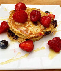 Chocolate & Banana Pancakes Alongside Fresh Fruit