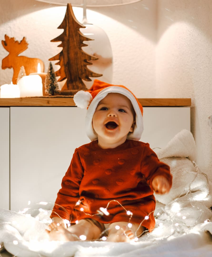 Baby wearing a Santa hat