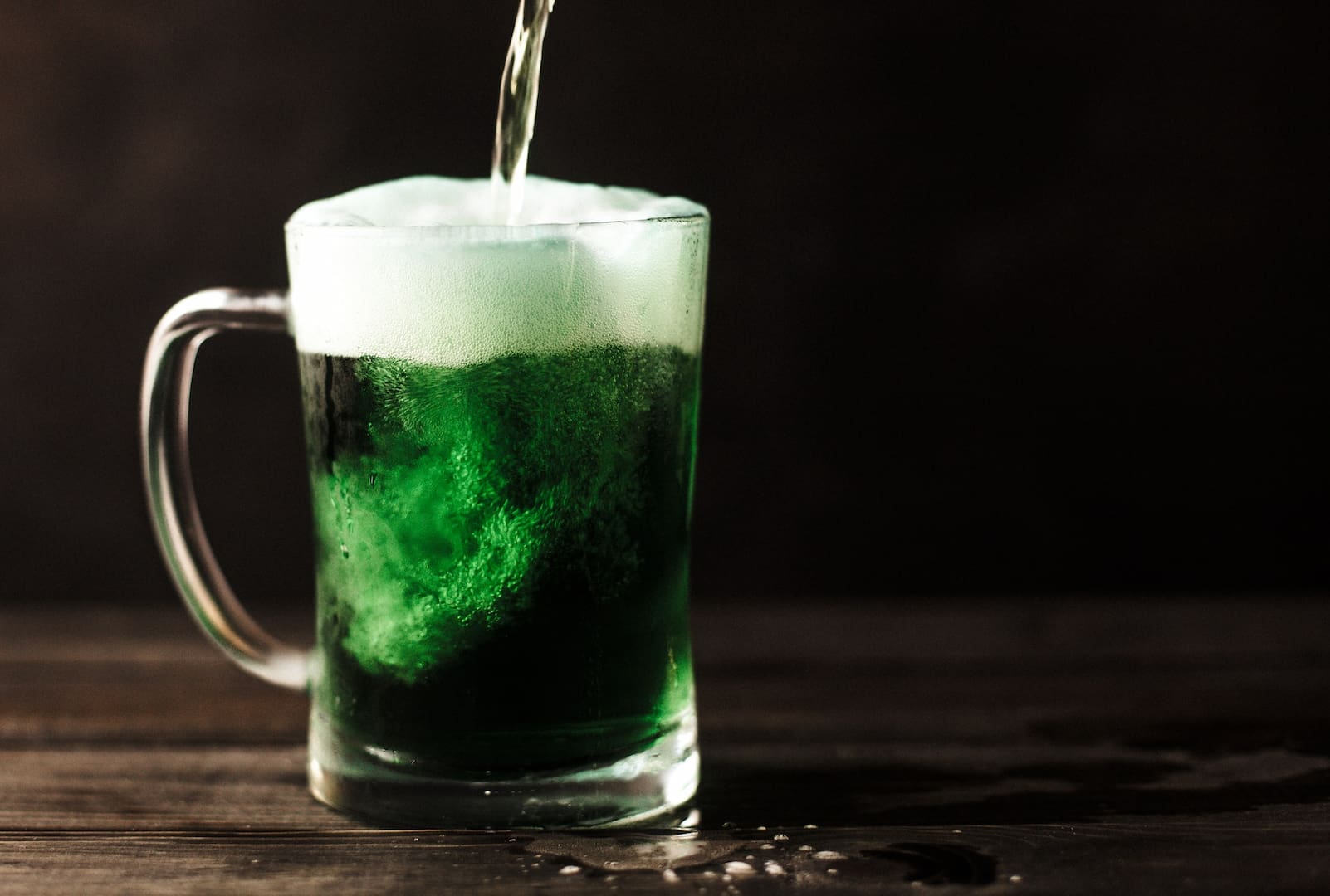 Green-colored beer in a mug