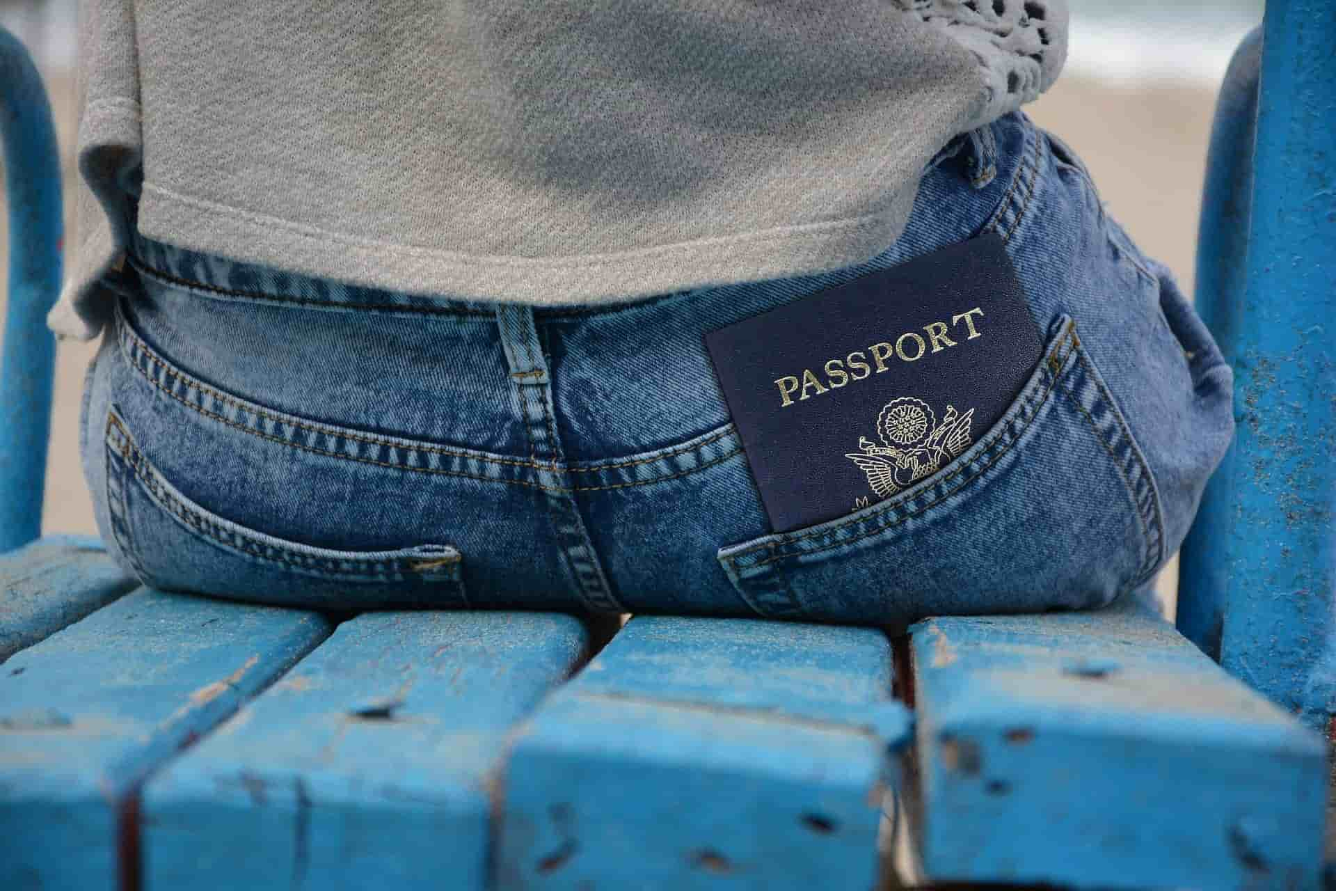 passport tucked into a jean pocket