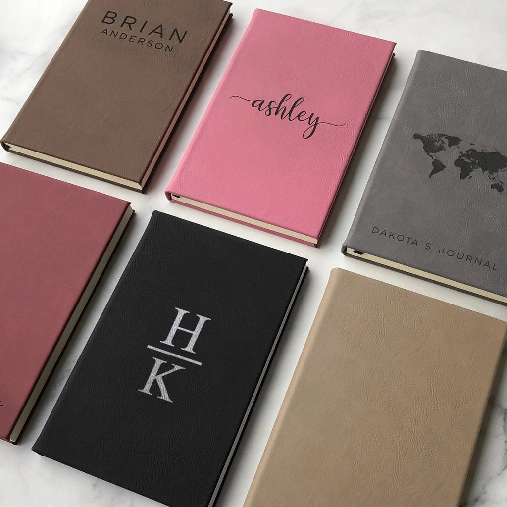 A set of six personalized journals in different colors