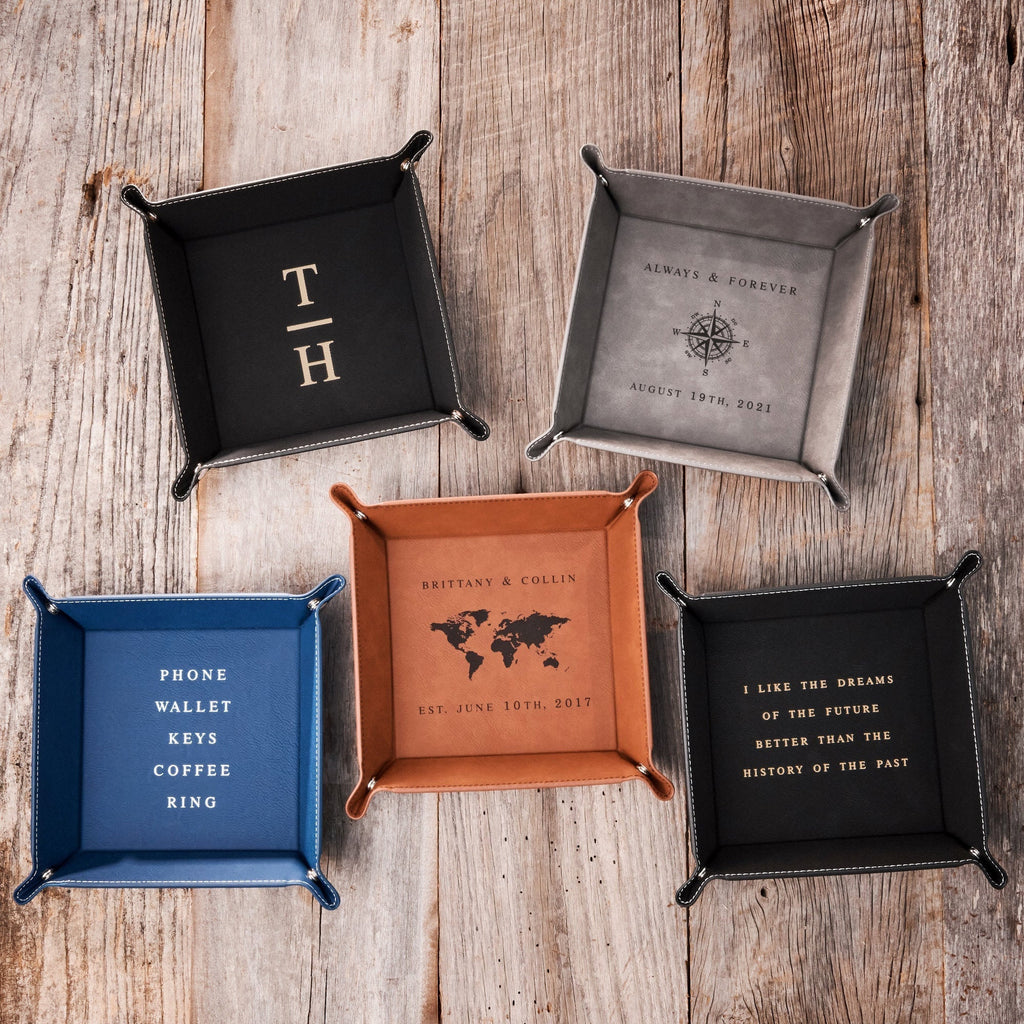 Five leatherette valet trays in different styles and colors