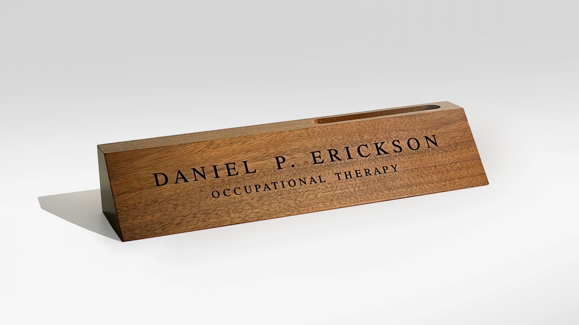 A wooden nameplace for a desk