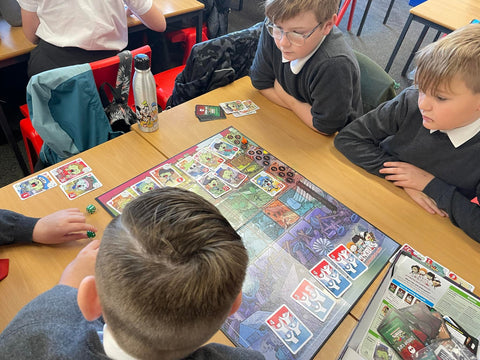 Kids enjoying a board game in classroom