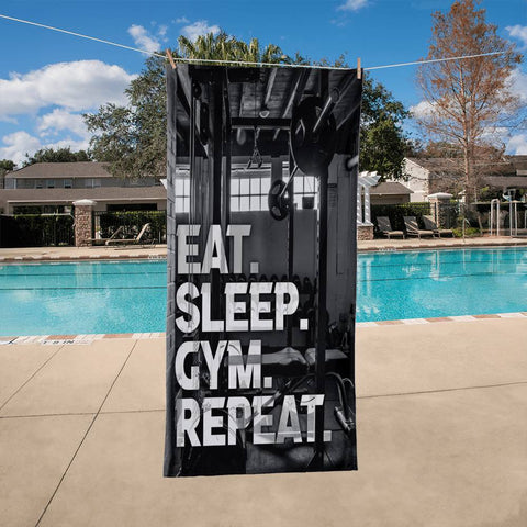 Blackish Bath Towel with the words EAT. SLEEP. GYM. REPEAT.