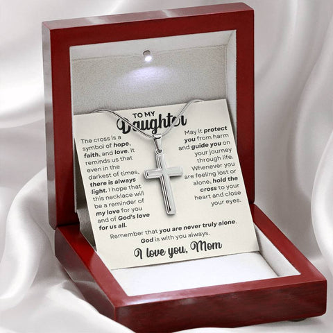 A heartfelt message card accompanies a stunning Stainless Steel Cross Necklace. The card expresses a mother's love and wishes for her daughter's faith and protection. The necklace, suitable for all ages and genders, features artisan-crafted details that set it apart from others. It includes a luxurious adjustable snake chain (18" - 22") with an easy-to-use lobster clasp. The pendant's dimensions are 1.3" in height (33.5mm) and 0.8" in width (19mm). The perfect gift for special occasions or everyday wear."