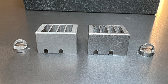 First samples from production MIM tooling on the left, 3D printed prototypes on the right.