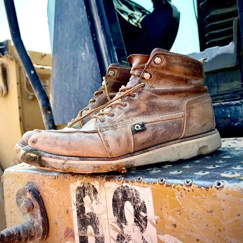 Used work boots on tractor