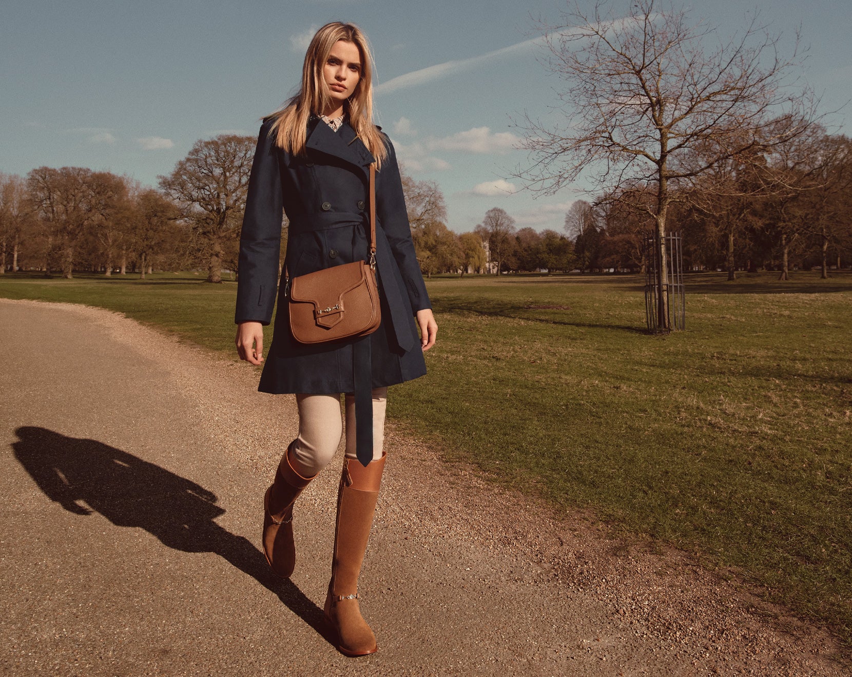 model wearing the kitty jacket, the fitzwilliam saddle bag, and the octavia tan flat boot.