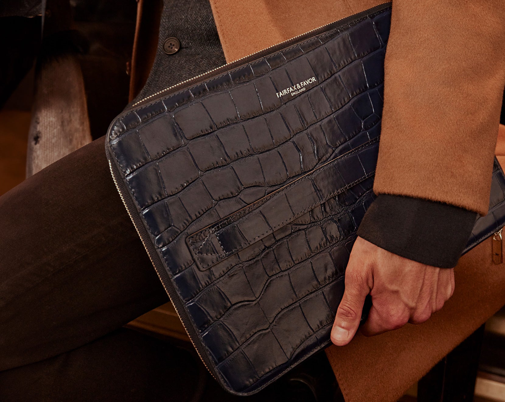 Male Model Holding the Moorgate Folio.