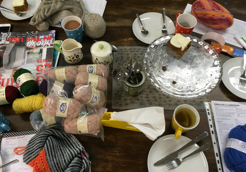 Messy table at the woolly brew knit and crochet group