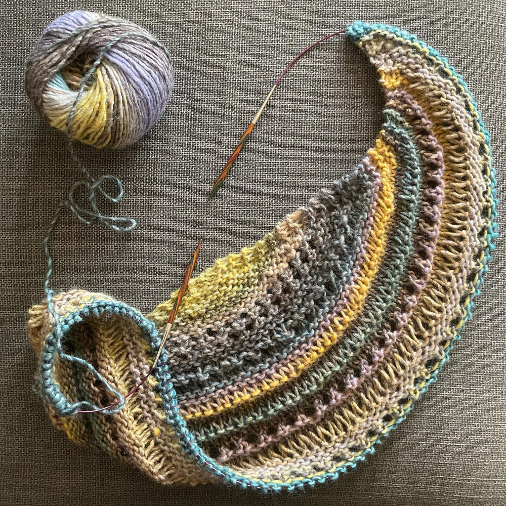 unfinished shawl in yellows and teals