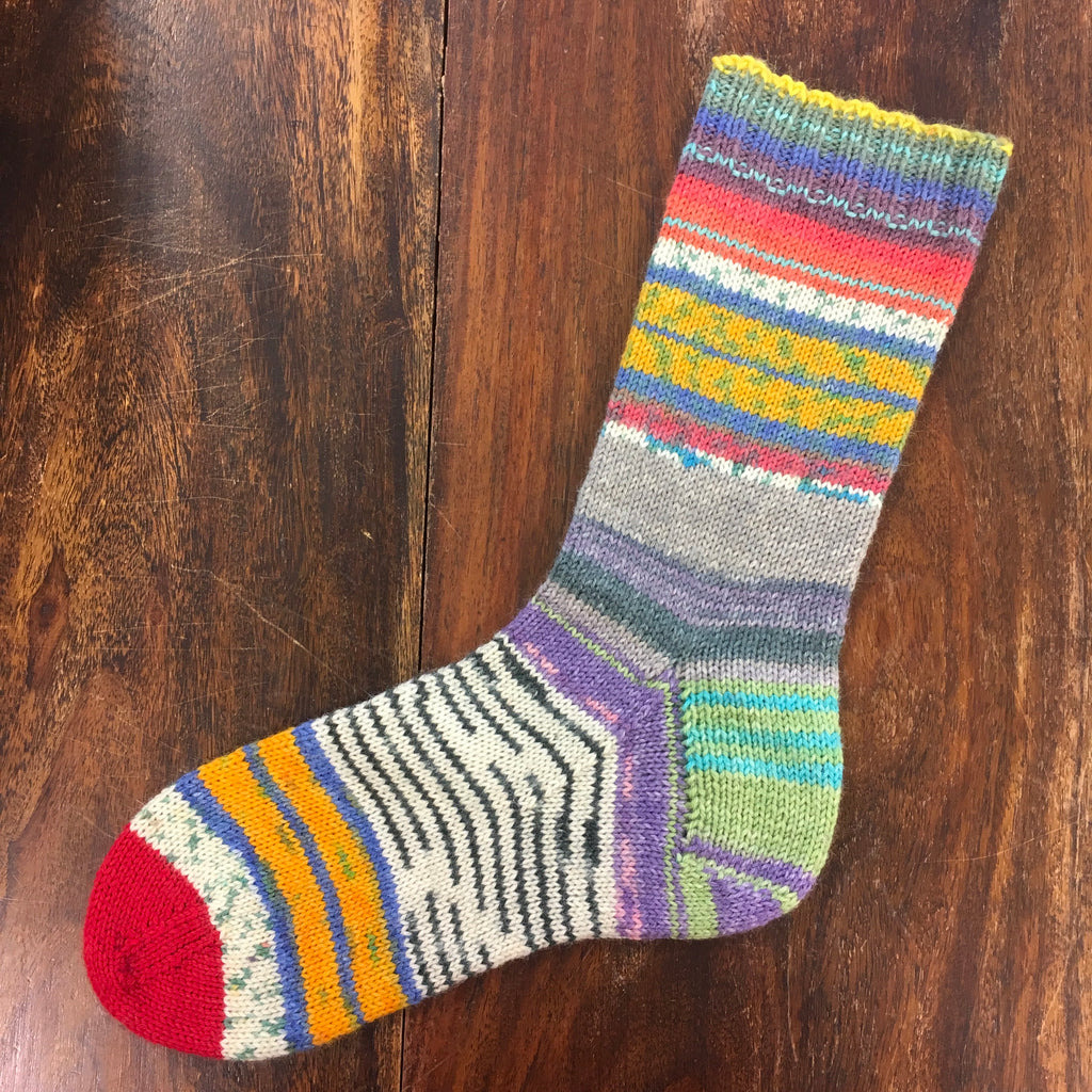 sock in mismatched pattern and colours