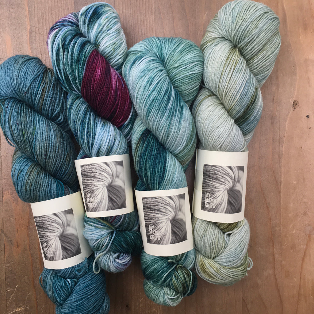 my mama knits hand dyed yarn in shades of blue green at the woolly brew