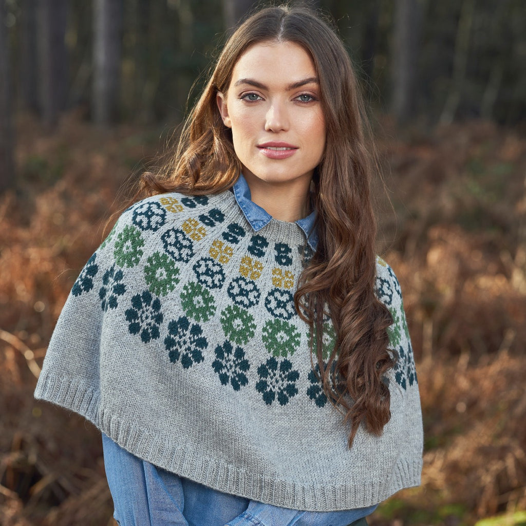 grey poncho with coloured flowers