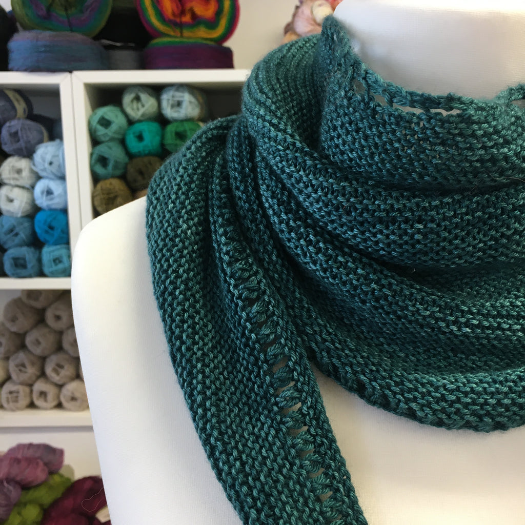close up of a simple shawl in gigha merino silk yarn