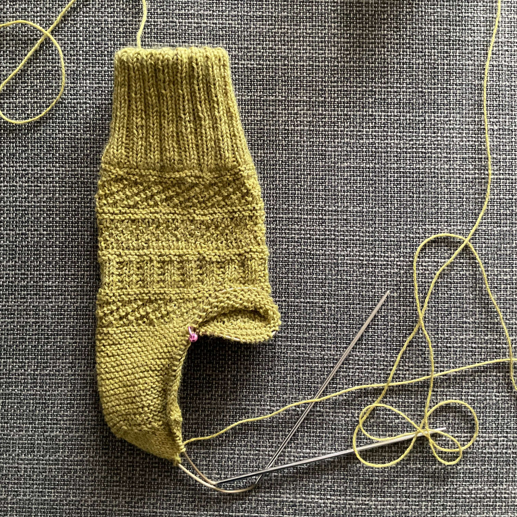 knitted sock with stitch patterns