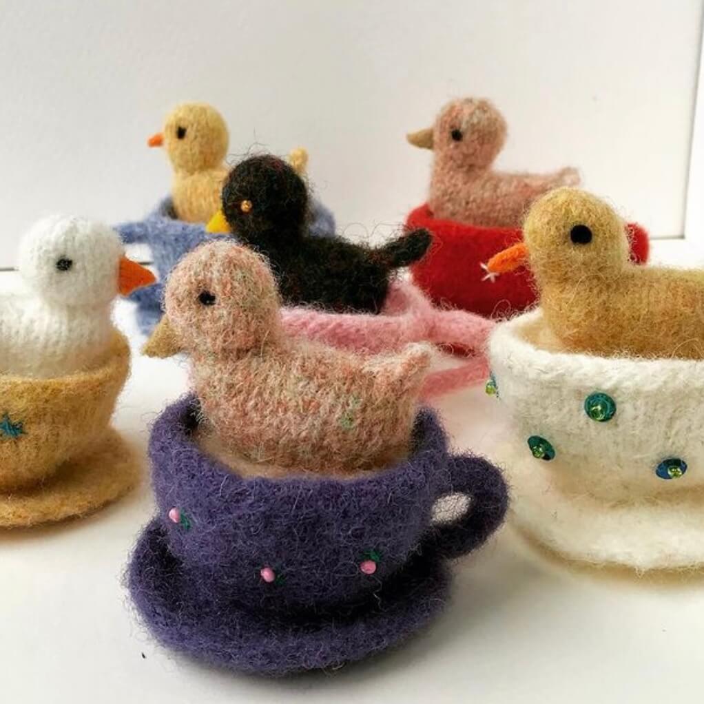 knitted ducklings in teacups