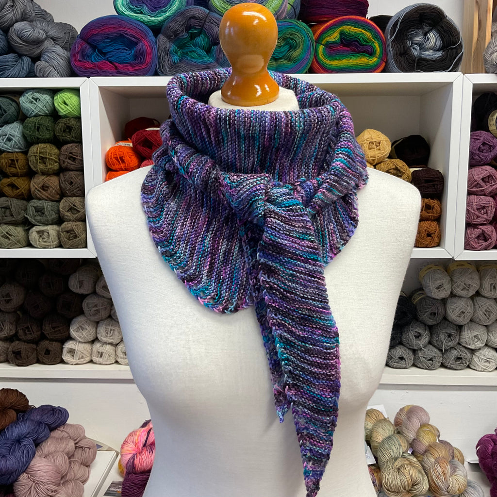 purple shallow triangle scarf folded and tied around neck
