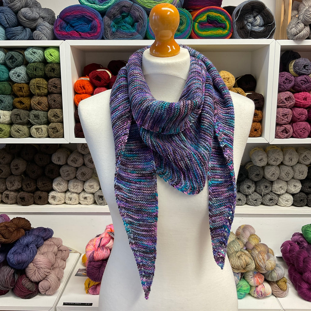 purple shallow triangle scarf wrapped around neck