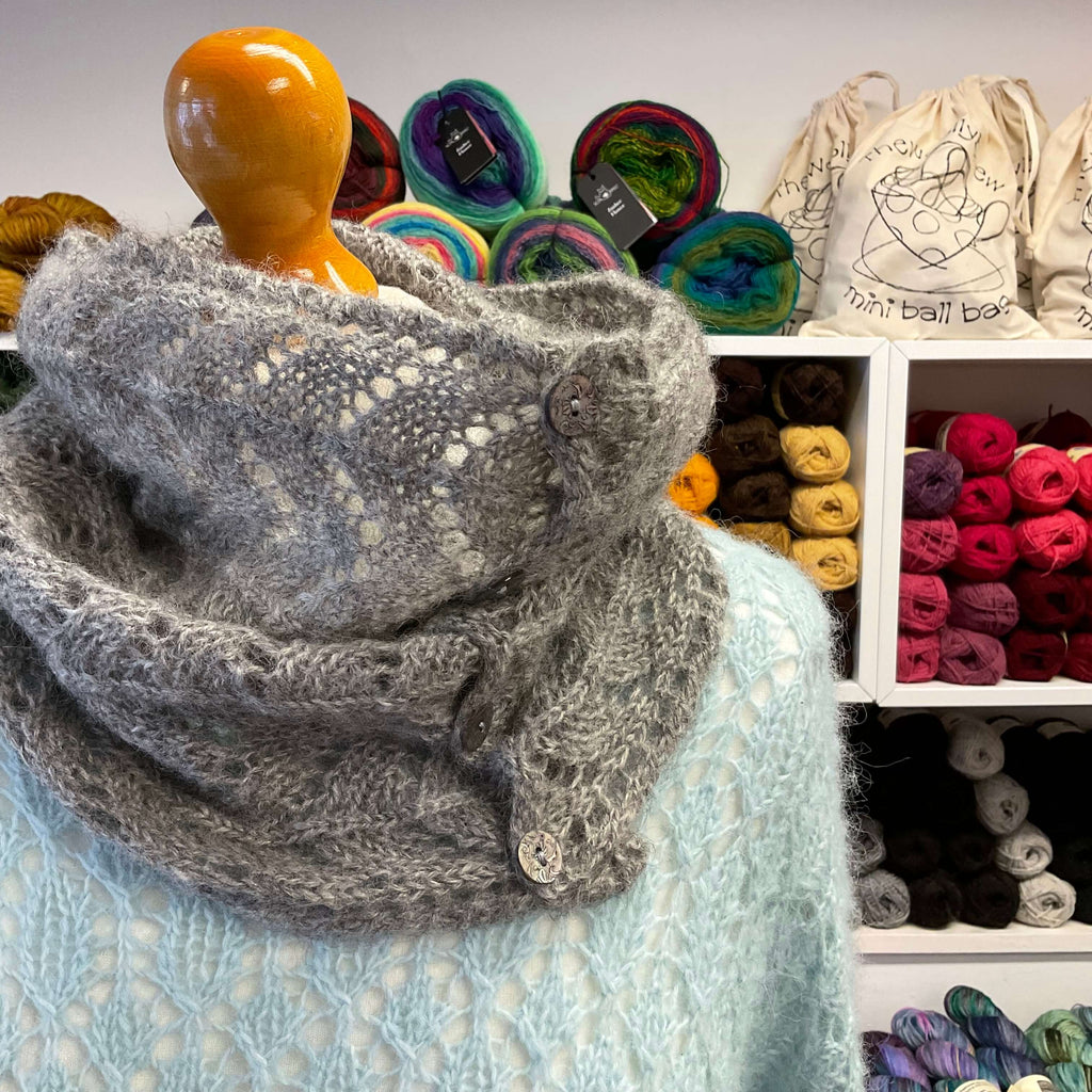 grey lace cowl worn with a blue lace jumper