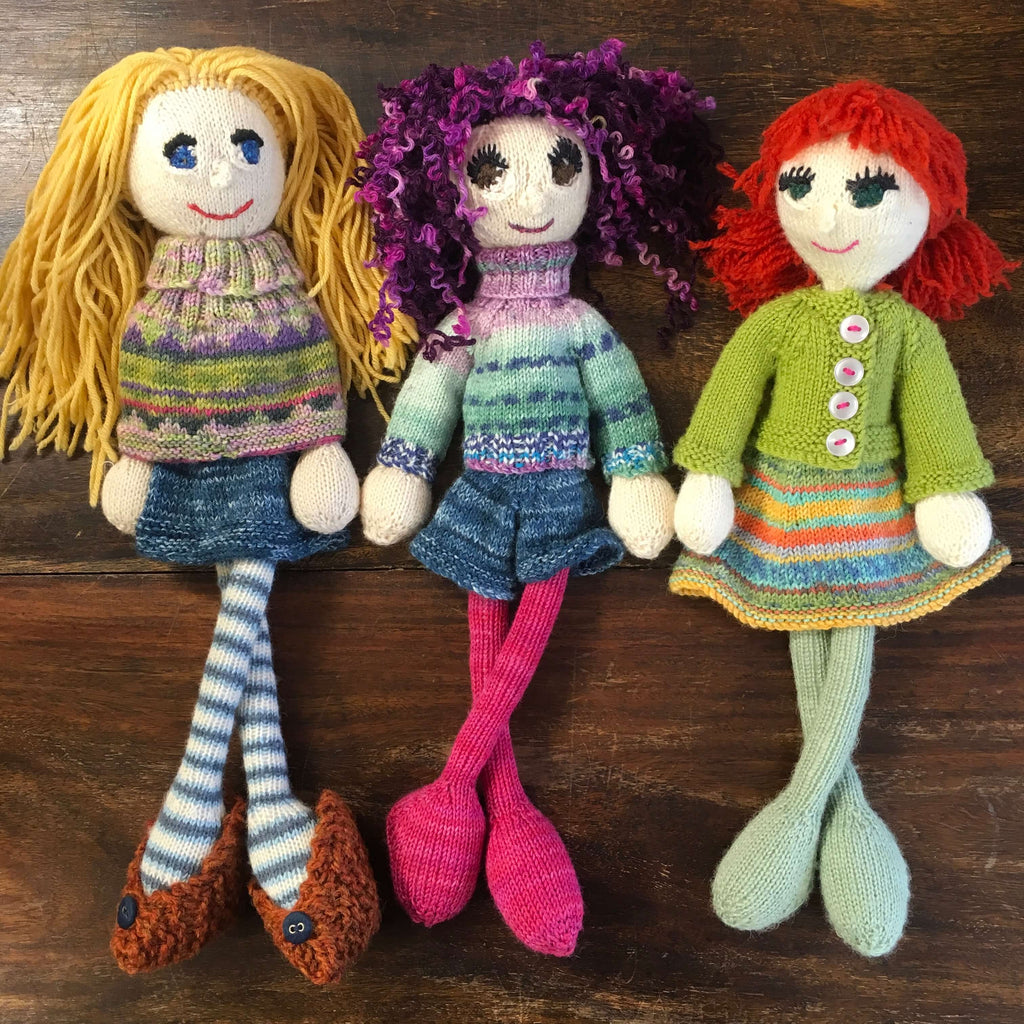 3 knitted dolls