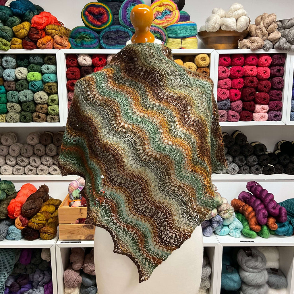 green and browns hand knit shawl at the woolly brew