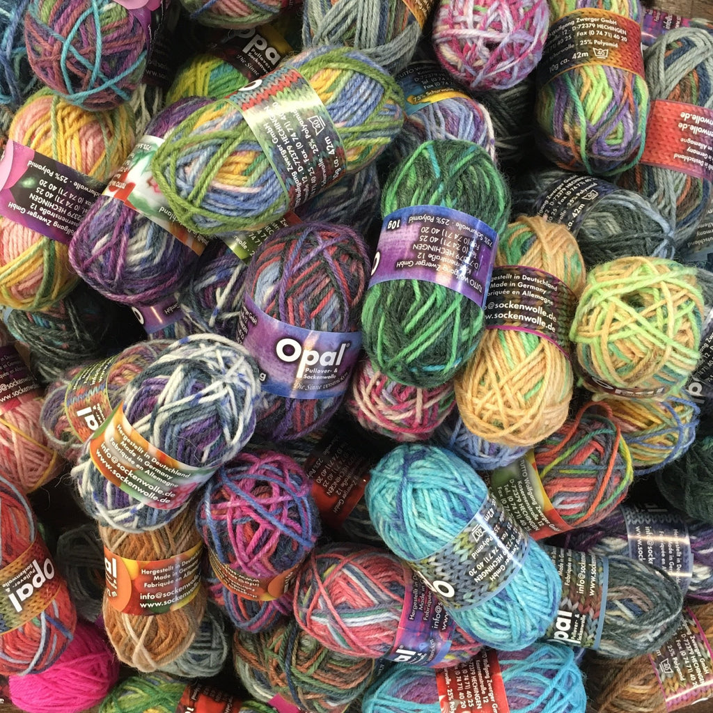 pile of mini balls of Opal 4ply sock yarn at the woolly brew