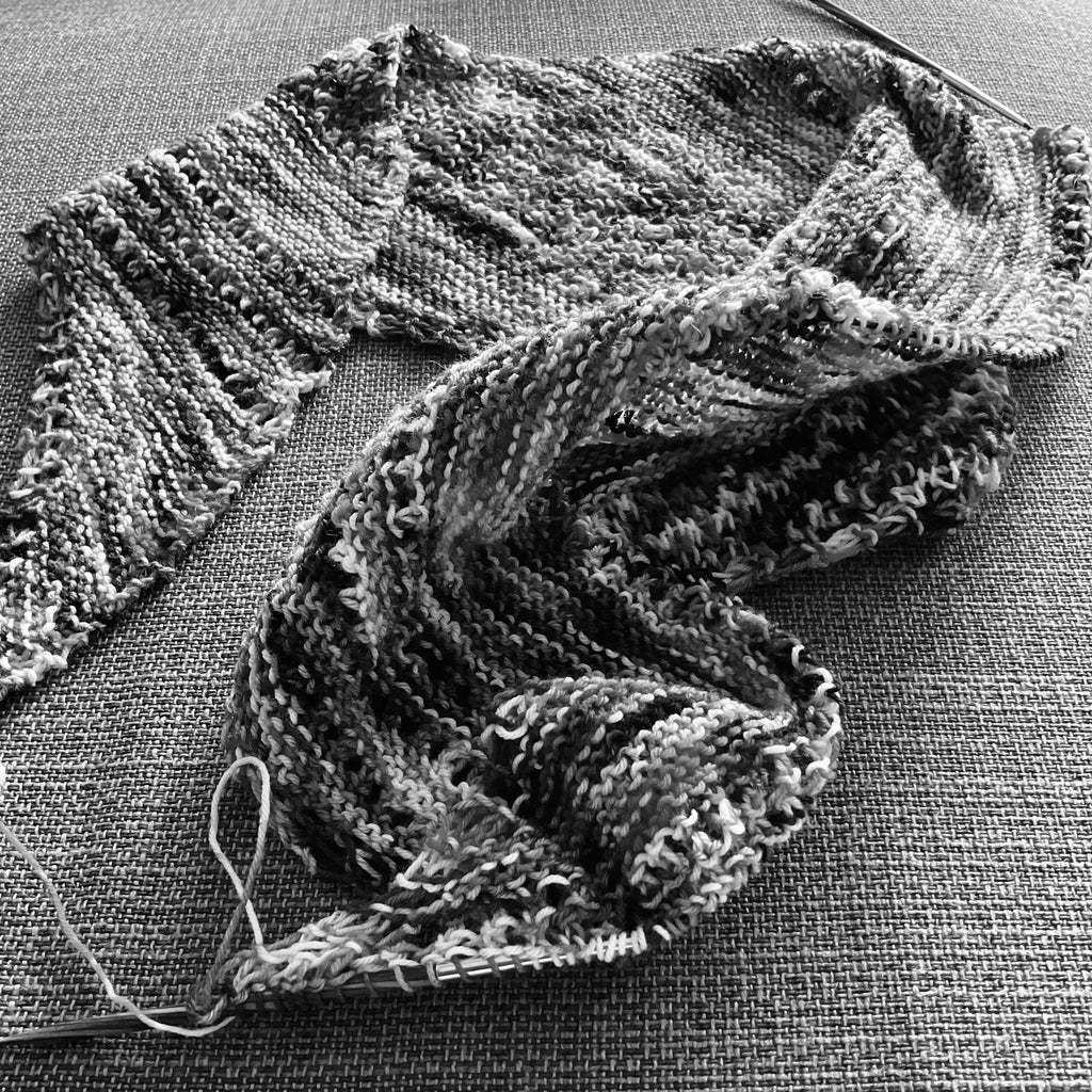 black and white photo of unfinished shawl