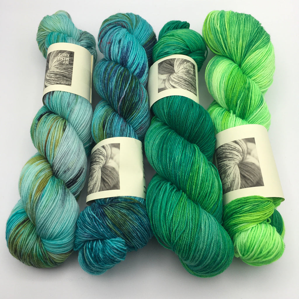 4 hanks of hand dyed yarn from turquoise to lime green 