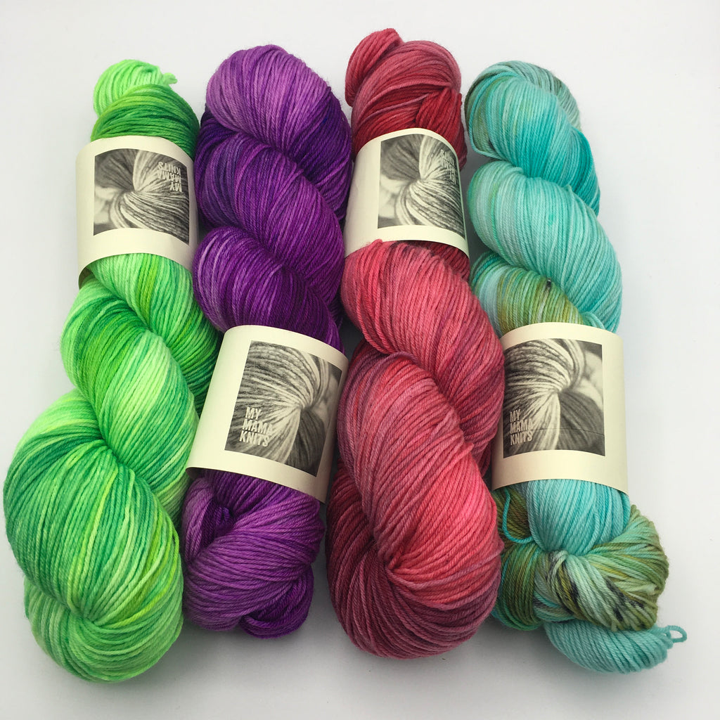 4 hanks of brightly coloured yarn