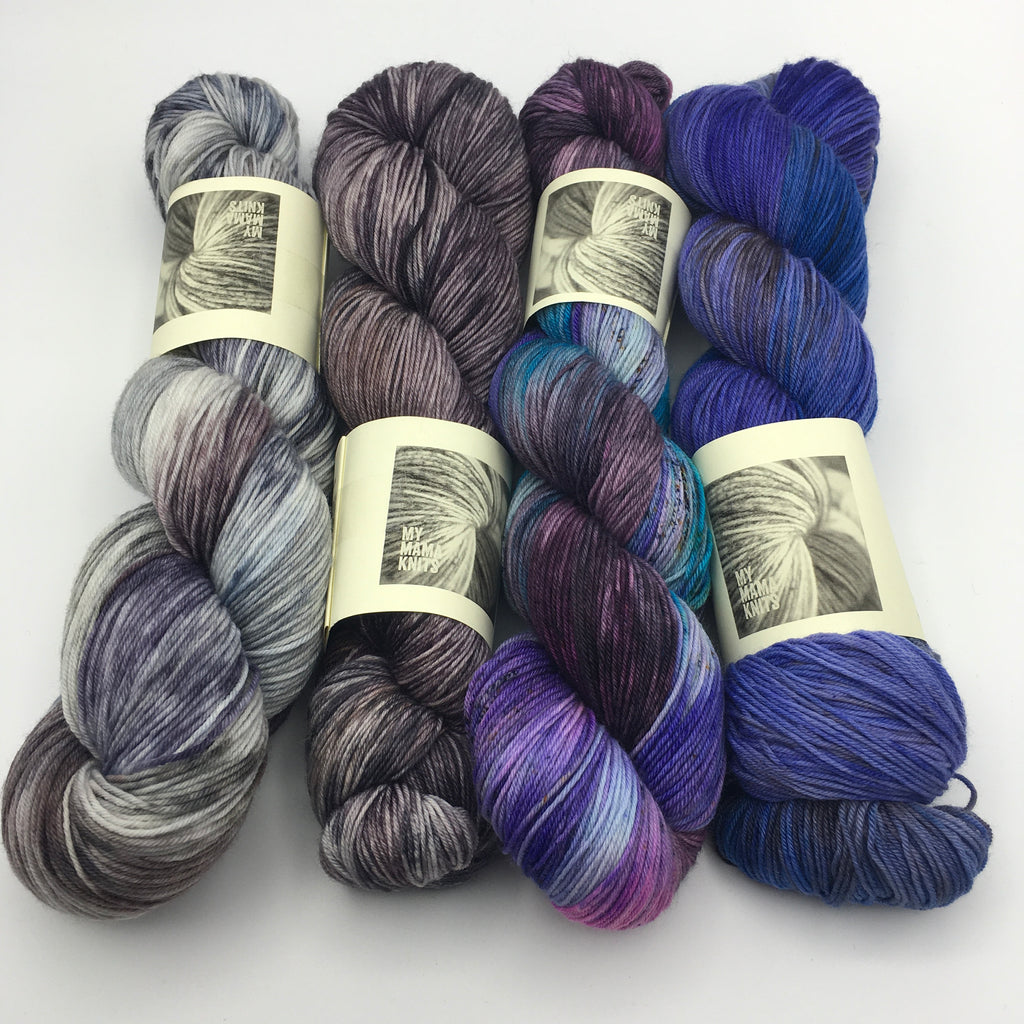 4 hanks of hand dyed yarn from beige grey to purples