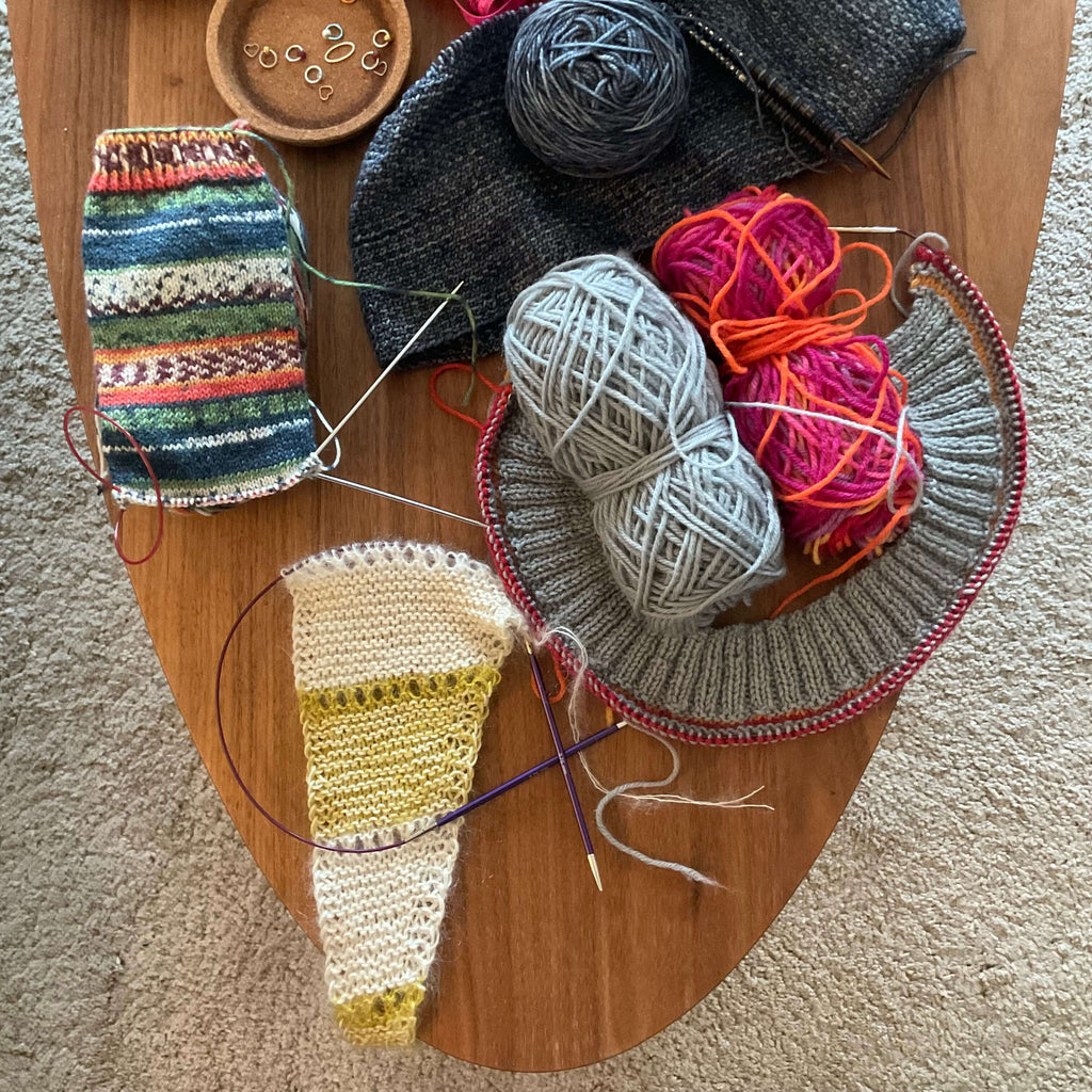 coffee table of knitting projects