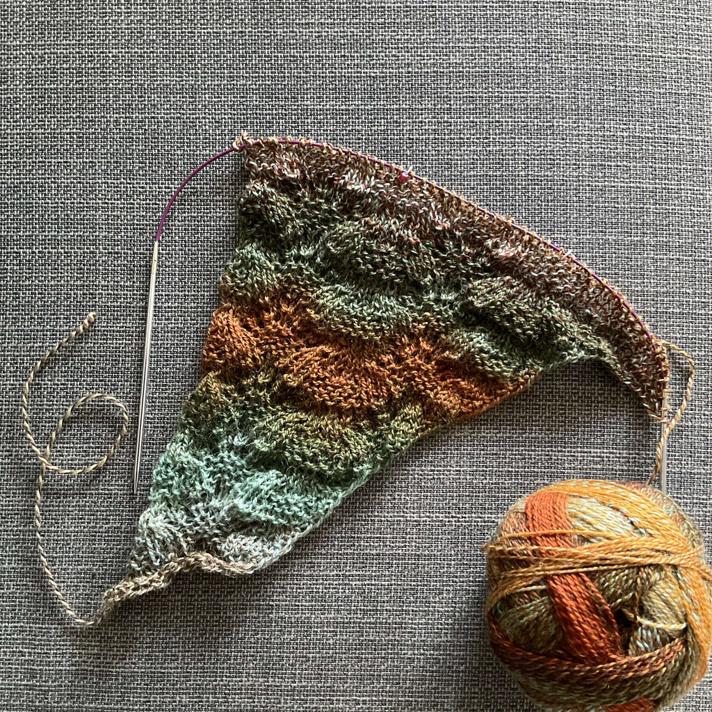 start of a shawl in shades of green and brown