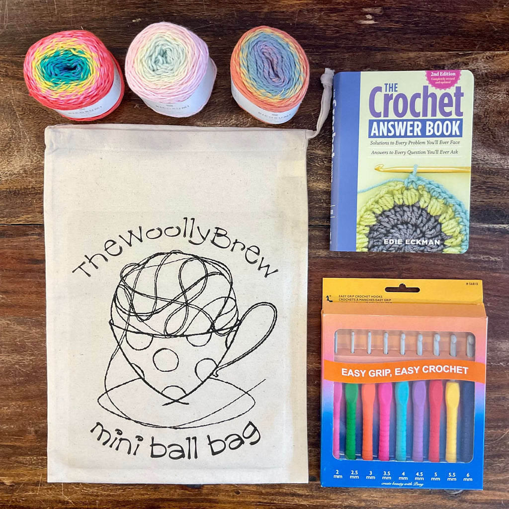 crochet book and hooks and yarn