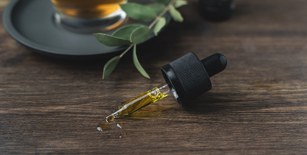 A countertop with an oil dropper of CBD oil.