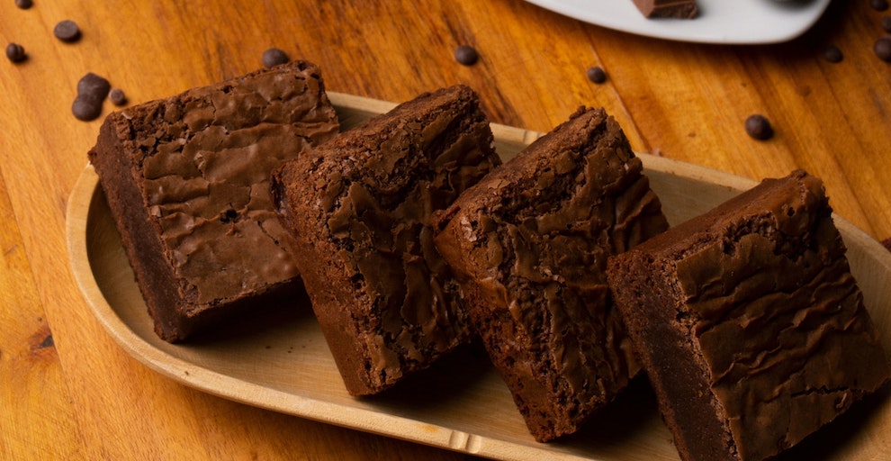four brownies on a plate