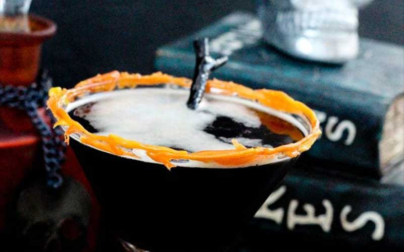 A halloween-inspired coffee martini with melted candy corn.