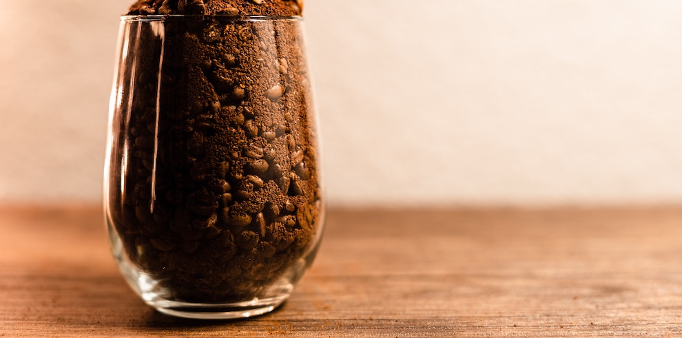 glass filled with coffee grounds