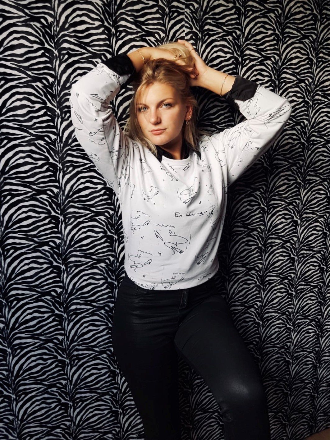cute white womens sweater with black pattern all over the sweatshirt