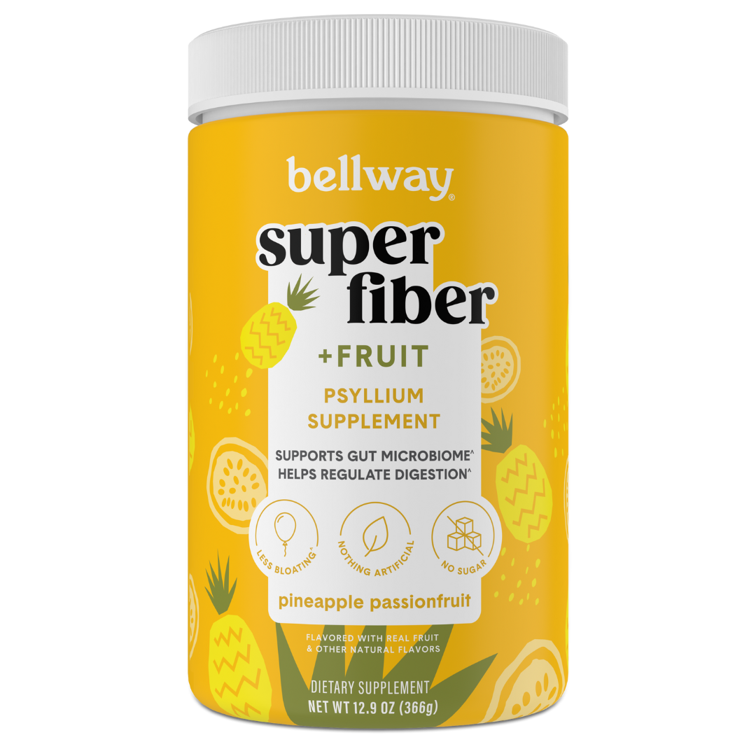 A container of Bellway Super Fiber + Fruit psyllium supplement with pineapple passionfruit flavor.