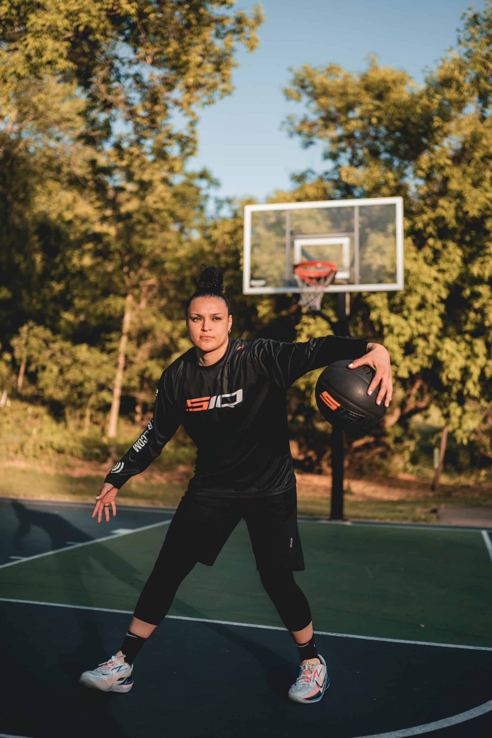Kayla McBride, professional female basketball player on WNBA's Minnesota Lynx, using the outdoor women's smart basketball.