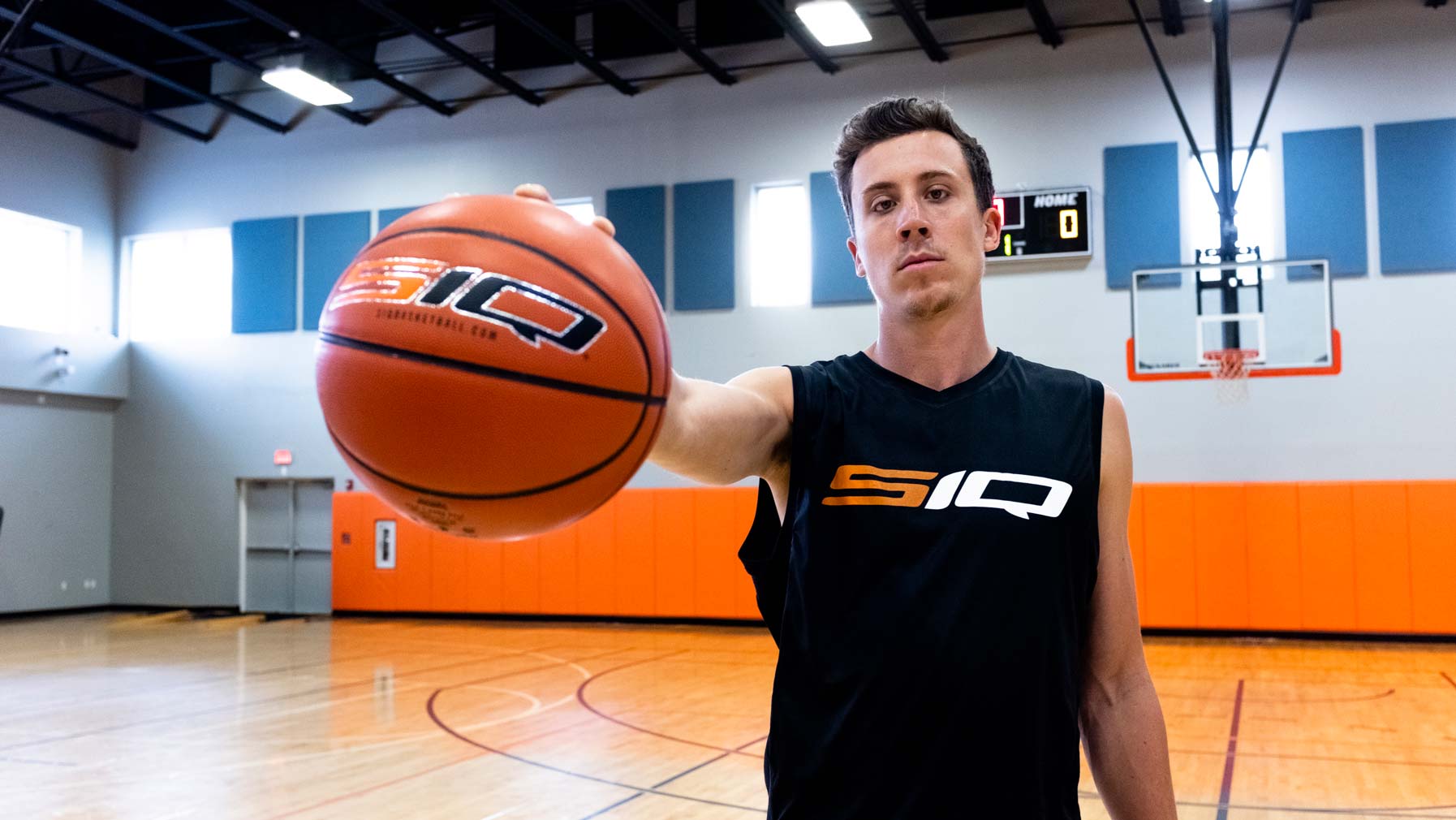 Duncan Robinson, professional basketball player on the NBA's Miami Heat, using the indoor men's smart basketball.