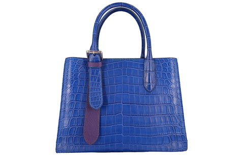 This picture shows a crocodile leather bag with a contrasting color design, which has a strong visual effect: the contrasting color leather bag combines the combination of different colors to create a sharp and contrasting visual effect, highlighting personal style. This bold color combination attracts attention and makes your bag the focal point of the entire look, showing off style and personality