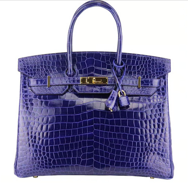 Le sac classique en cuir de crocodile présente un design élégant et des couleurs de cuir distinctives, et les détails montrent un sentiment de luxe et de qualité. Ce sac hérite de la valeur intemporelle des sacs en cuir de crocodile avec son design classique.