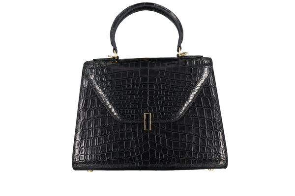 This crocodile leather bag showcases a fusion of innovation and style, combining unique tailoring with edgy black crystal accents. This modern design element gives the crocodile leather bag a more fashionable appearance that is eye-catching.