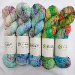 a five skein fade including light blues, greens and pops or orange.