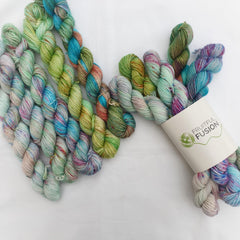mini skeins with pale blues, greens and pops of orange